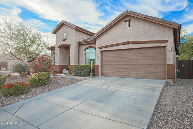 view of front of home with a garage