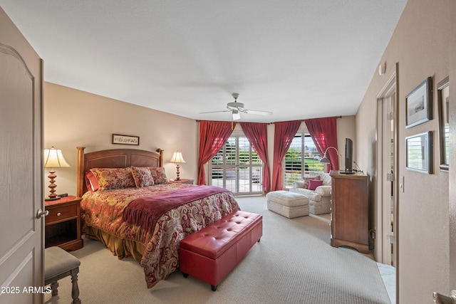 carpeted bedroom featuring a ceiling fan