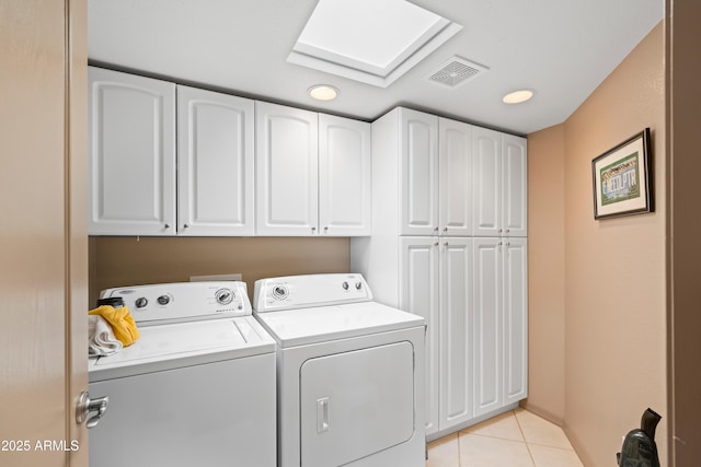 washroom with visible vents, washing machine and dryer, recessed lighting, light tile patterned flooring, and cabinet space