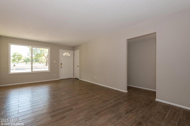 3741 W Poinsettia Dr, Phoenix, AZ 85029 - spare room featuring dark wood finished floors and baseboards