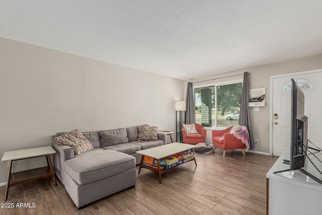 3741 W Poinsettia Dr, Phoenix, AZ 85029 - living room featuring wood finished floors and baseboards