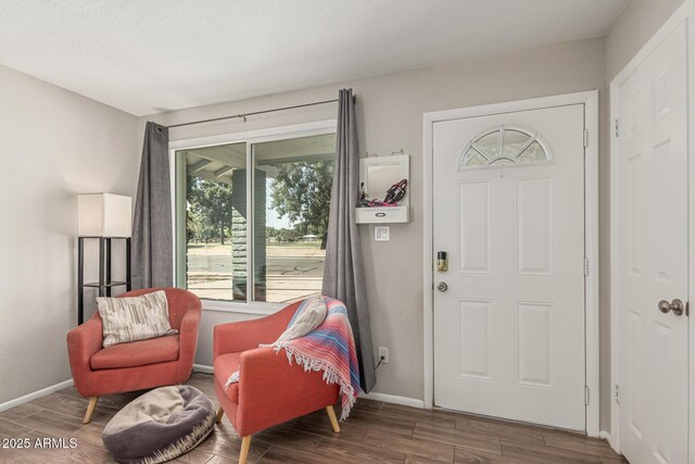 3741 W Poinsettia Dr, Phoenix, AZ 85029 - foyer entrance featuring wood finished floors and baseboards