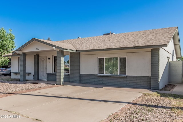 3741 W Poinsettia Dr, Phoenix, AZ 85029 - single story home with brick siding, roof with shingles, and covered porch