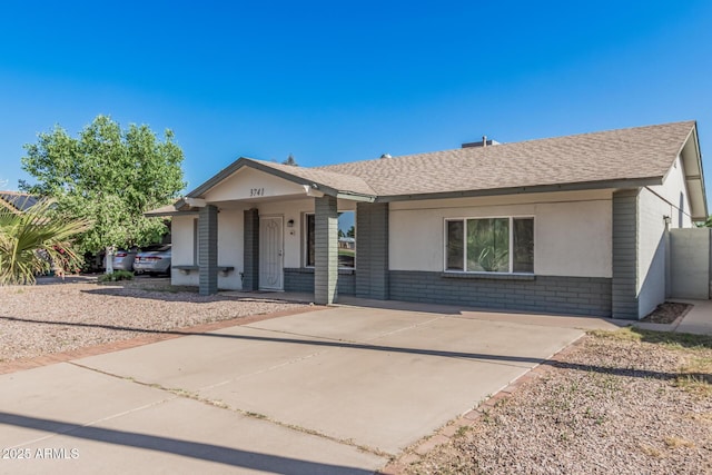 3741 W Poinsettia Dr, Phoenix, AZ 85029 - single story home featuring brick siding, a shingled roof, and a porch