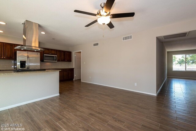 3741 W Poinsettia Dr, Phoenix, AZ 85029 - kitchen featuring appliances with stainless steel finishes, island range hood, decorative backsplash, a ceiling fan, and baseboards