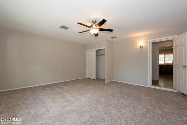 3741 W Poinsettia Dr, Phoenix, AZ 85029 - unfurnished bedroom with carpet flooring, a closet, baseboards, and a ceiling fan