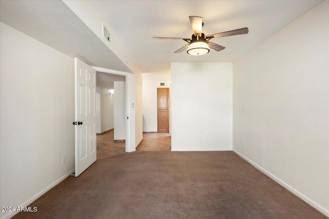 empty room featuring light carpet and ceiling fan