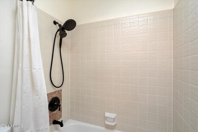 details featuring shower / bathtub combination with curtain