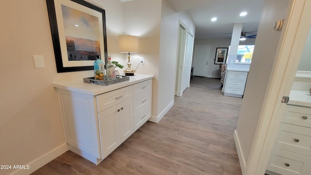 corridor featuring light hardwood / wood-style floors