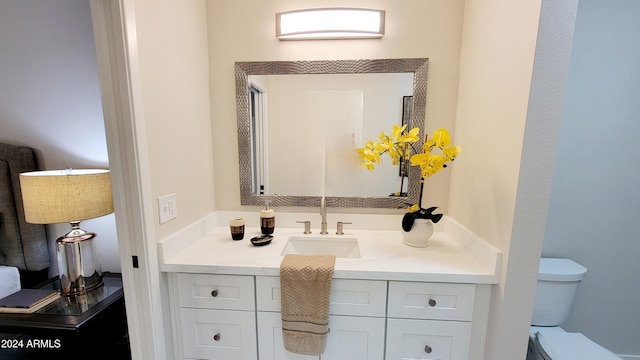 bathroom with vanity and toilet