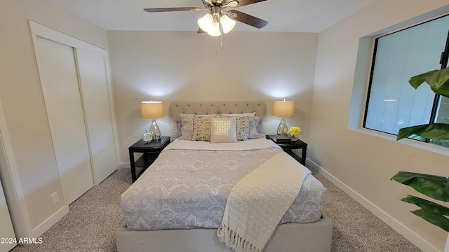 carpeted bedroom featuring a closet and ceiling fan