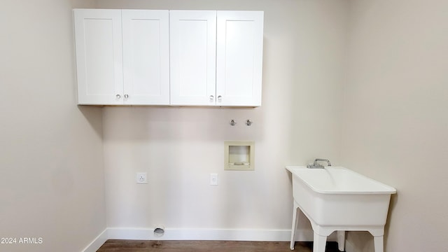 clothes washing area featuring sink, hookup for a washing machine, cabinets, and hookup for an electric dryer