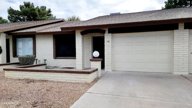 ranch-style house featuring a garage