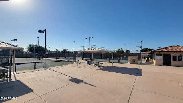 surrounding community with a gazebo and tennis court