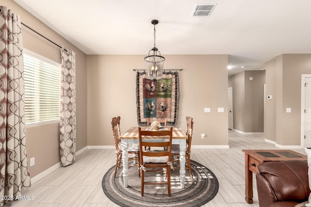 dining area with a chandelier