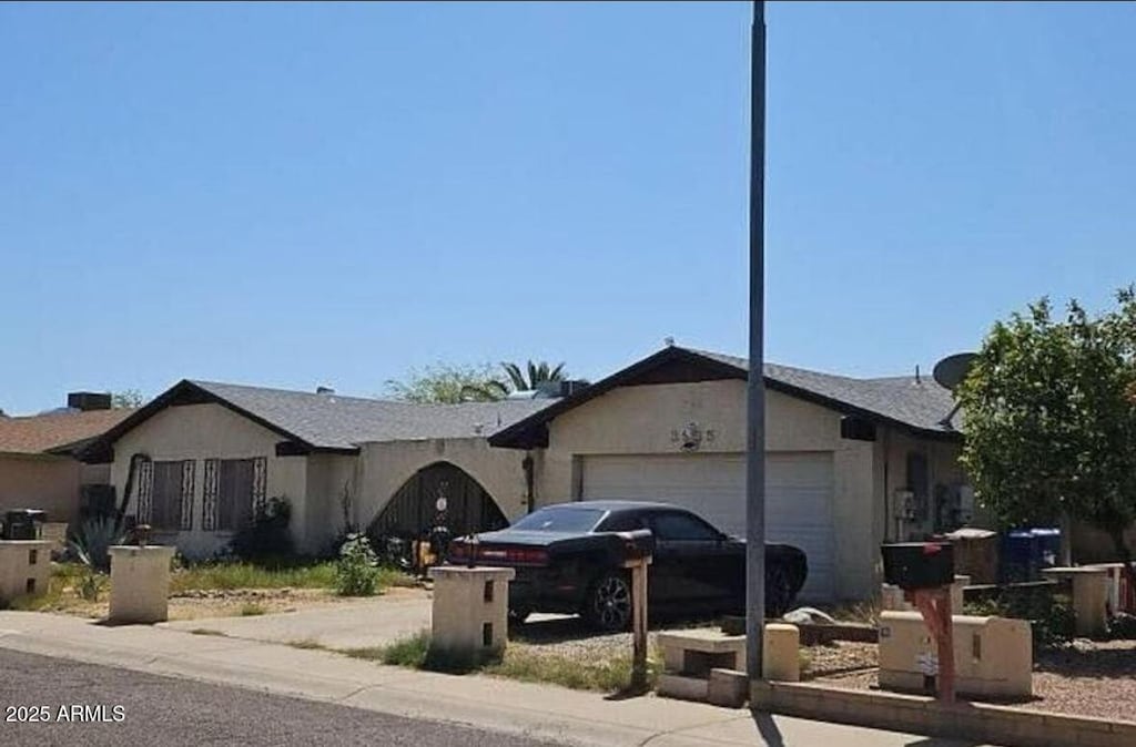 3935 W Muriel Dr, Glendale, AZ 85308 - ranch-style house with a garage and concrete driveway