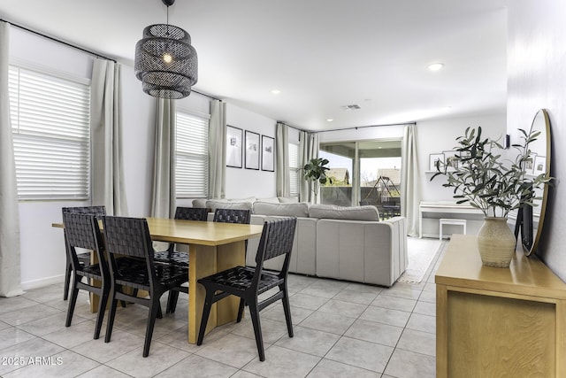 dining space with light tile patterned floors, visible vents, and recessed lighting