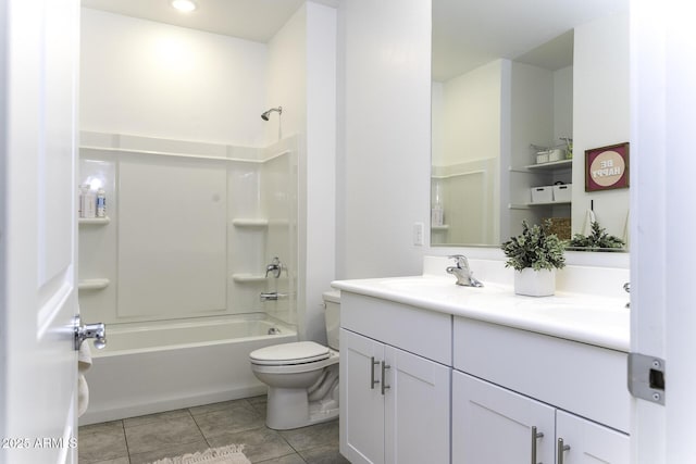 full bathroom with double vanity, a sink, toilet, and tile patterned floors