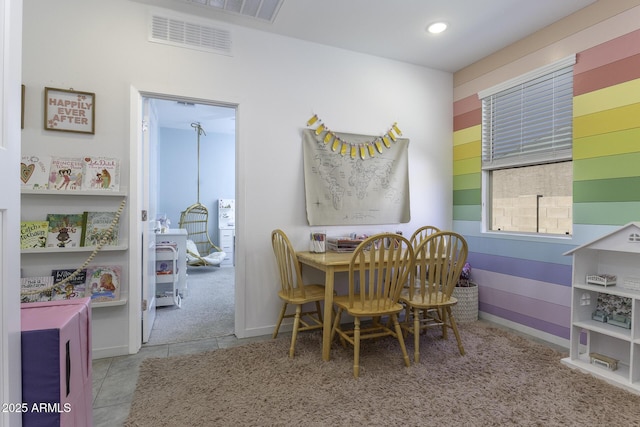 tiled dining room featuring recessed lighting, visible vents, and baseboards