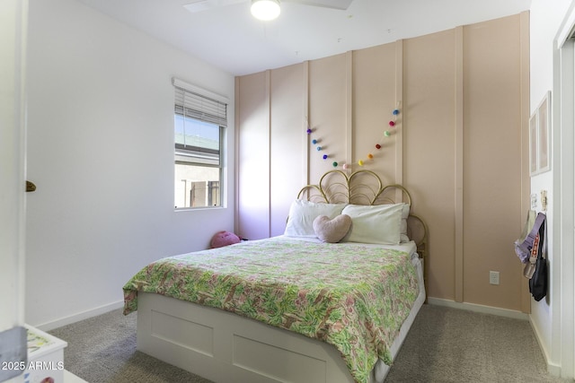 bedroom with a ceiling fan, light carpet, and baseboards