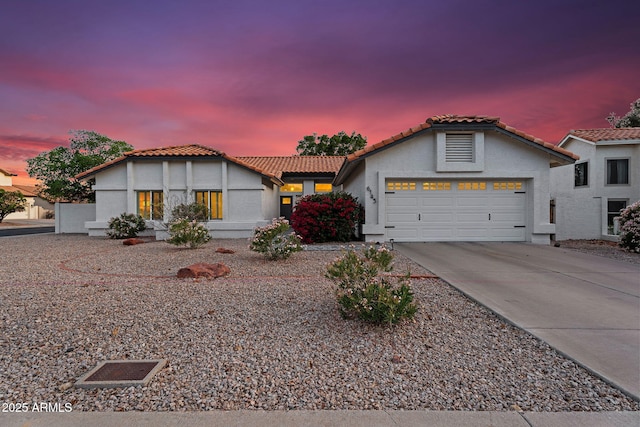 6145 E Snowdon St, Mesa, AZ 85215 - mediterranean / spanish-style home with a garage, stucco siding, a tile roof, and concrete driveway