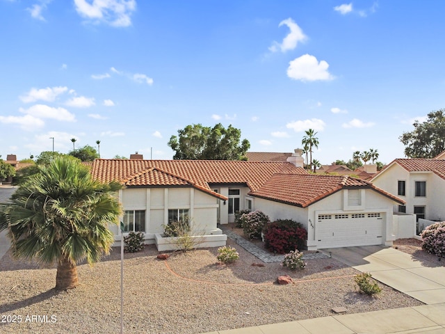 6145 E Snowdon St, Mesa, AZ 85215 - mediterranean / spanish home with stucco siding, driveway, a tile roof, and a garage
