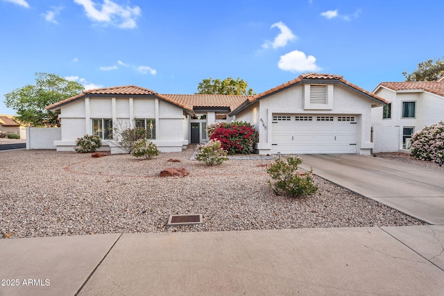 6145 E Snowdon St, Mesa, AZ 85215 - mediterranean / spanish-style home featuring stucco siding, an attached garage, driveway, and a tiled roof