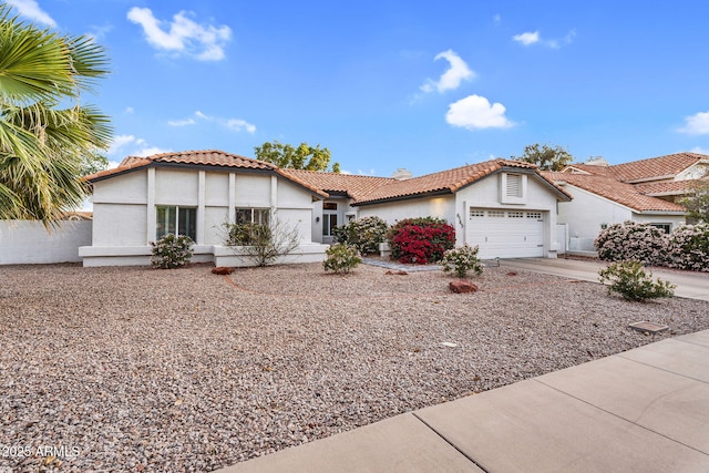 6145 E Snowdon St, Mesa, AZ 85215 - view of front of property featuring stucco siding, a tile roof, an attached garage, and concrete driveway