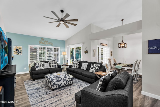 6145 E Snowdon St, Mesa, AZ 85215 - living room with a ceiling fan, baseboards, wood finished floors, high vaulted ceiling, and a chandelier