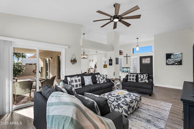 6145 E Snowdon St, Mesa, AZ 85215 - living area with ceiling fan, wood finished floors, healthy amount of natural light, baseboards, and high vaulted ceiling
