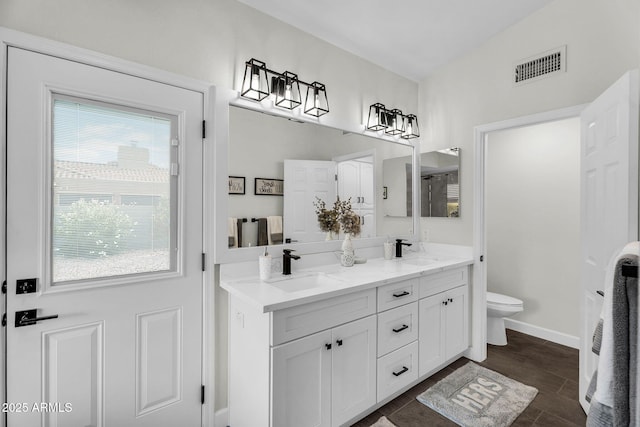6145 E Snowdon St, Mesa, AZ 85215 - full bath featuring double vanity, toilet, and baseboards