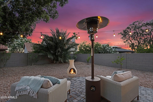6145 E Snowdon St, Mesa, AZ 85215 - patio terrace at dusk featuring a patio and a fenced backyard