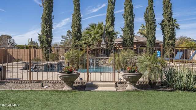 view of swimming pool featuring a patio area and a lawn