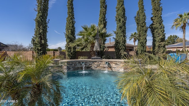 view of pool featuring pool water feature