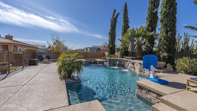 view of pool with a patio and pool water feature