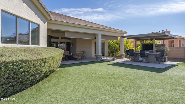 exterior space featuring a patio area and a lawn