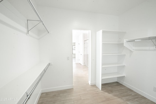 walk in closet featuring light hardwood / wood-style floors