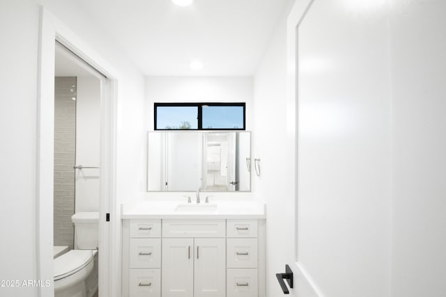 bathroom with vanity and toilet