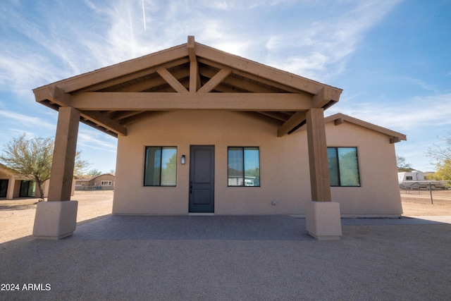 rear view of property featuring a patio