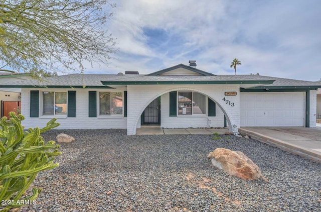 single story home featuring a garage