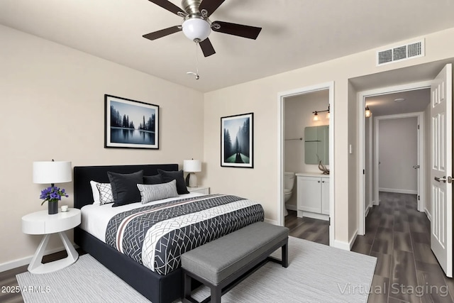 3114 W Villa Maria Dr, Phoenix, AZ 85053 - bedroom featuring dark wood-style floors, ensuite bath, and ceiling fan