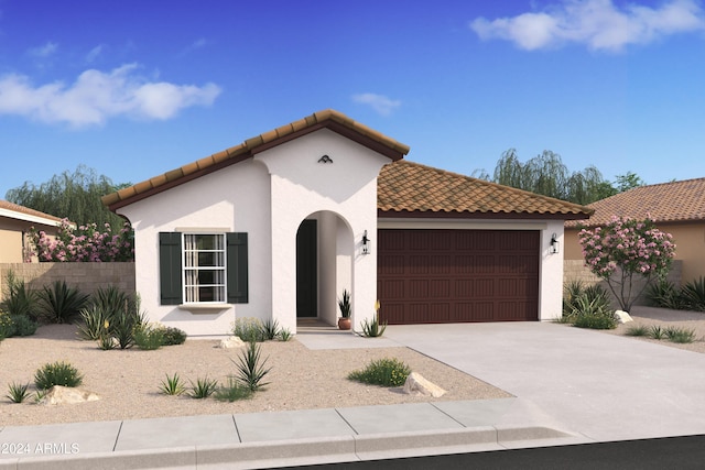 mediterranean / spanish house featuring a garage