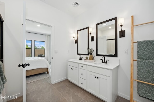 bathroom featuring vanity and a shower with door