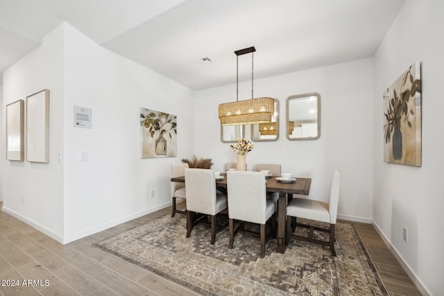 dining area with hardwood / wood-style flooring