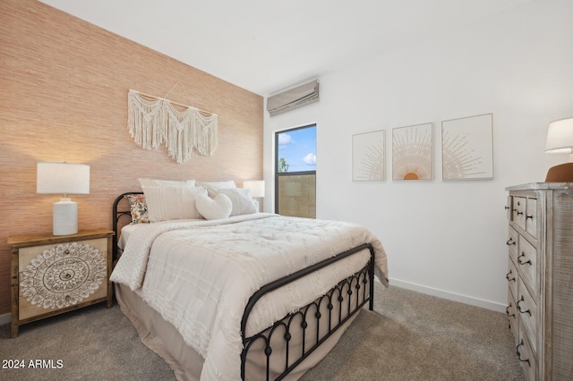 carpeted bedroom featuring a wall unit AC