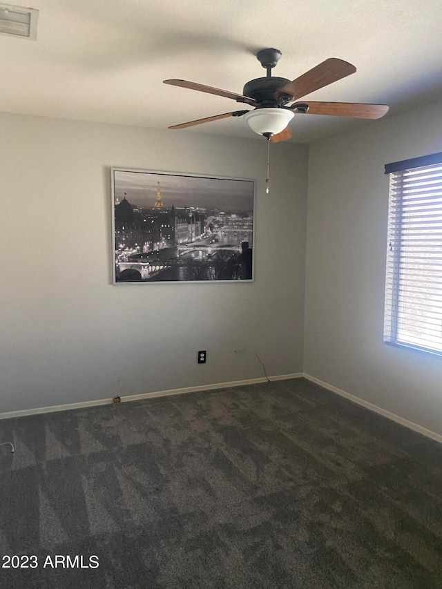 carpeted empty room with ceiling fan