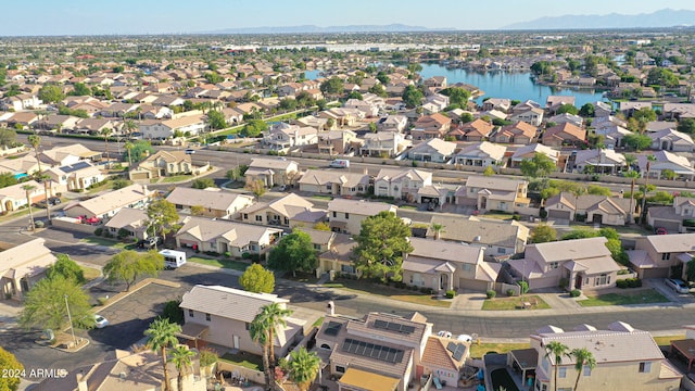 birds eye view of property featuring a water and mountain view