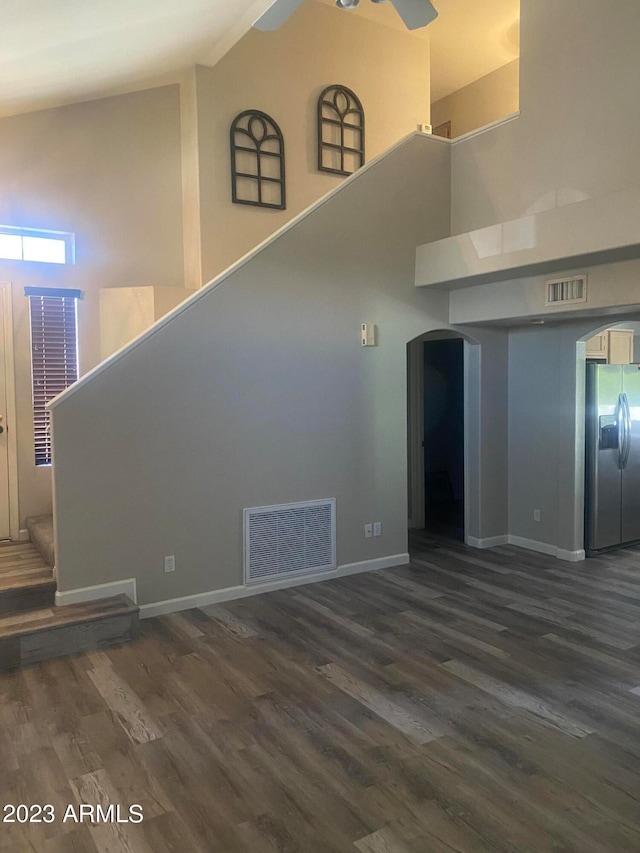 interior space with high vaulted ceiling, wood-type flooring, and ceiling fan