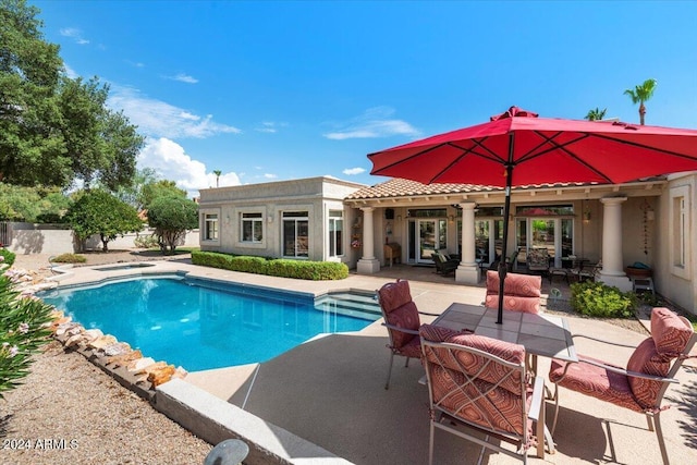 view of swimming pool with a patio area