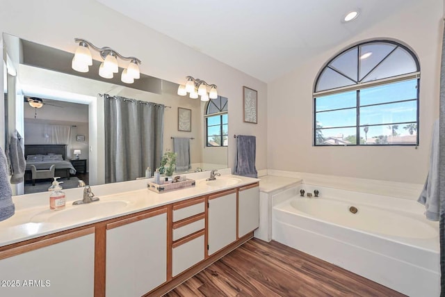 18807 N 42nd Ave, Glendale, AZ 85308 - full bath with a sink, ensuite bathroom, a garden tub, and wood finished floors